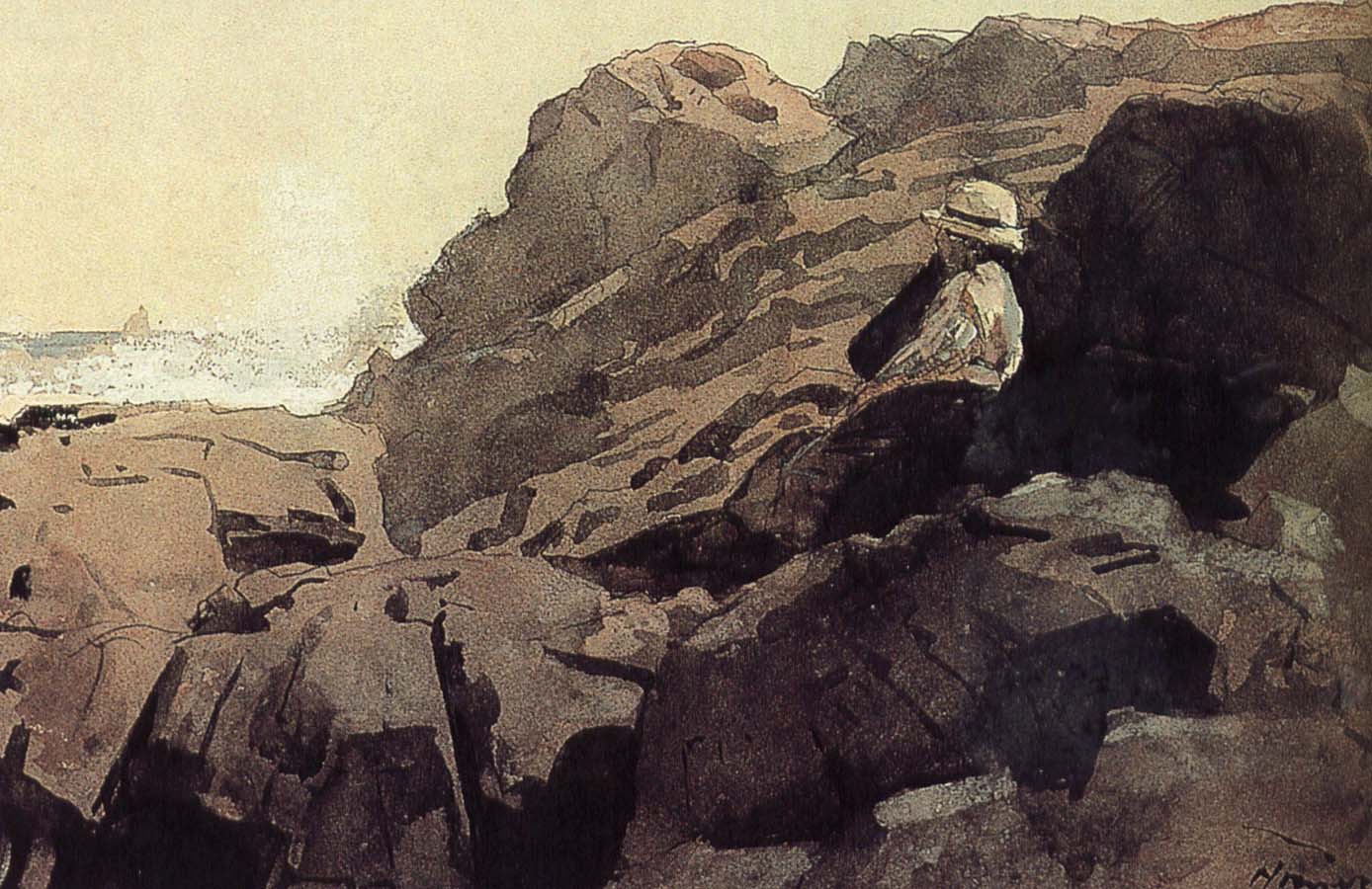 A boy sitting on the rocks